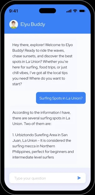 Mobile device showing the Elyu Buddy AI chat app, featuring a friendly conversation where the AI recommends surfing spots and local experiences in La Union.